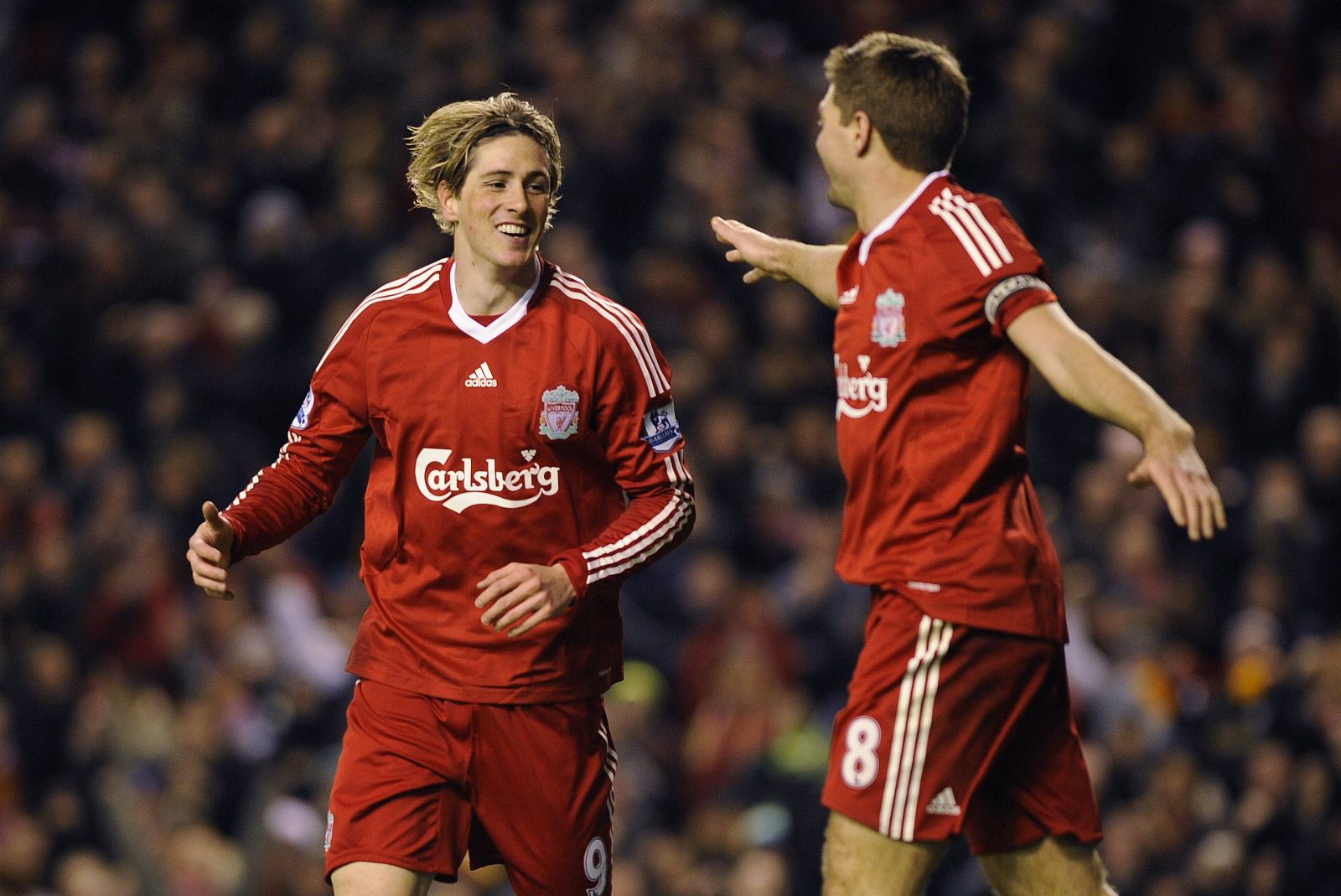 Liverpool's Fernando Torres celebrates with Steven Gerrard after scoring against Wigan during their English Premier League soccer match at Anfield in Liverpool
