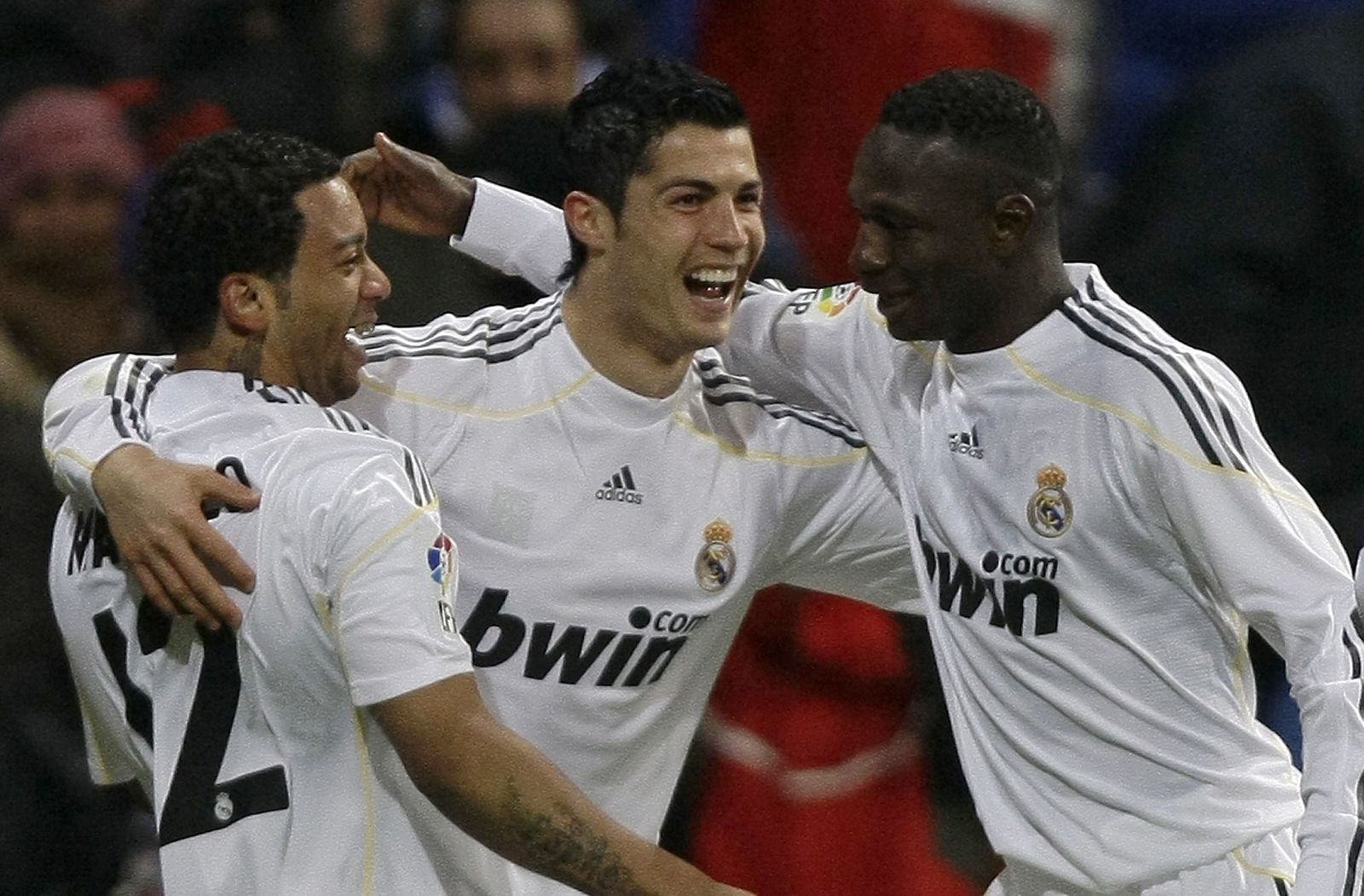 Real Madrid's Cristiano Ronaldo celebrates his goal with his teammates Marcelo and Mahamadou Diarra during their Spanish First Division soccer match against Zaragoza  at Santiago Bernabeu stadium