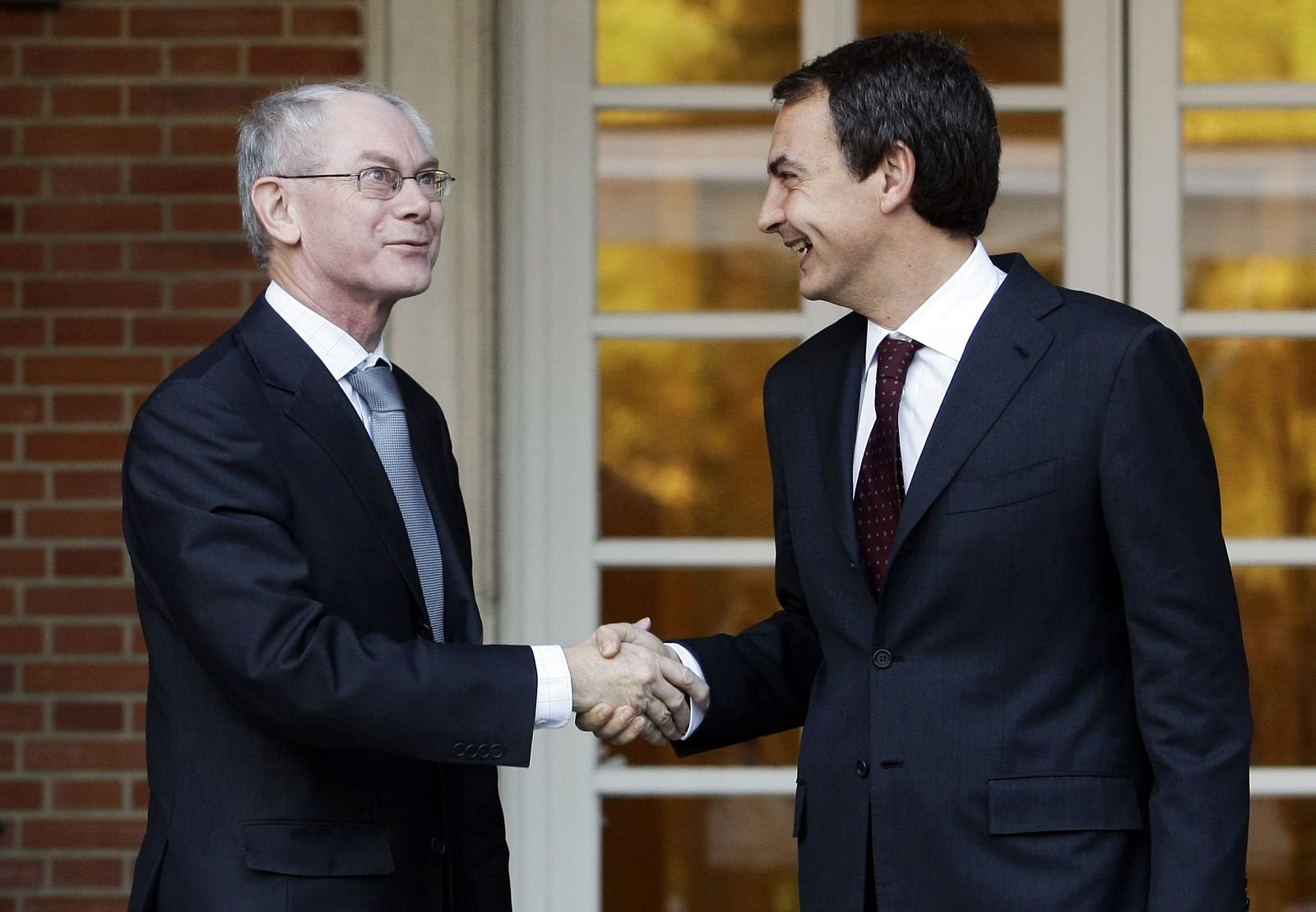Spanish PM Zapatero shakes hands with European Council President Rompuy at Madrid's Moncloa Palace