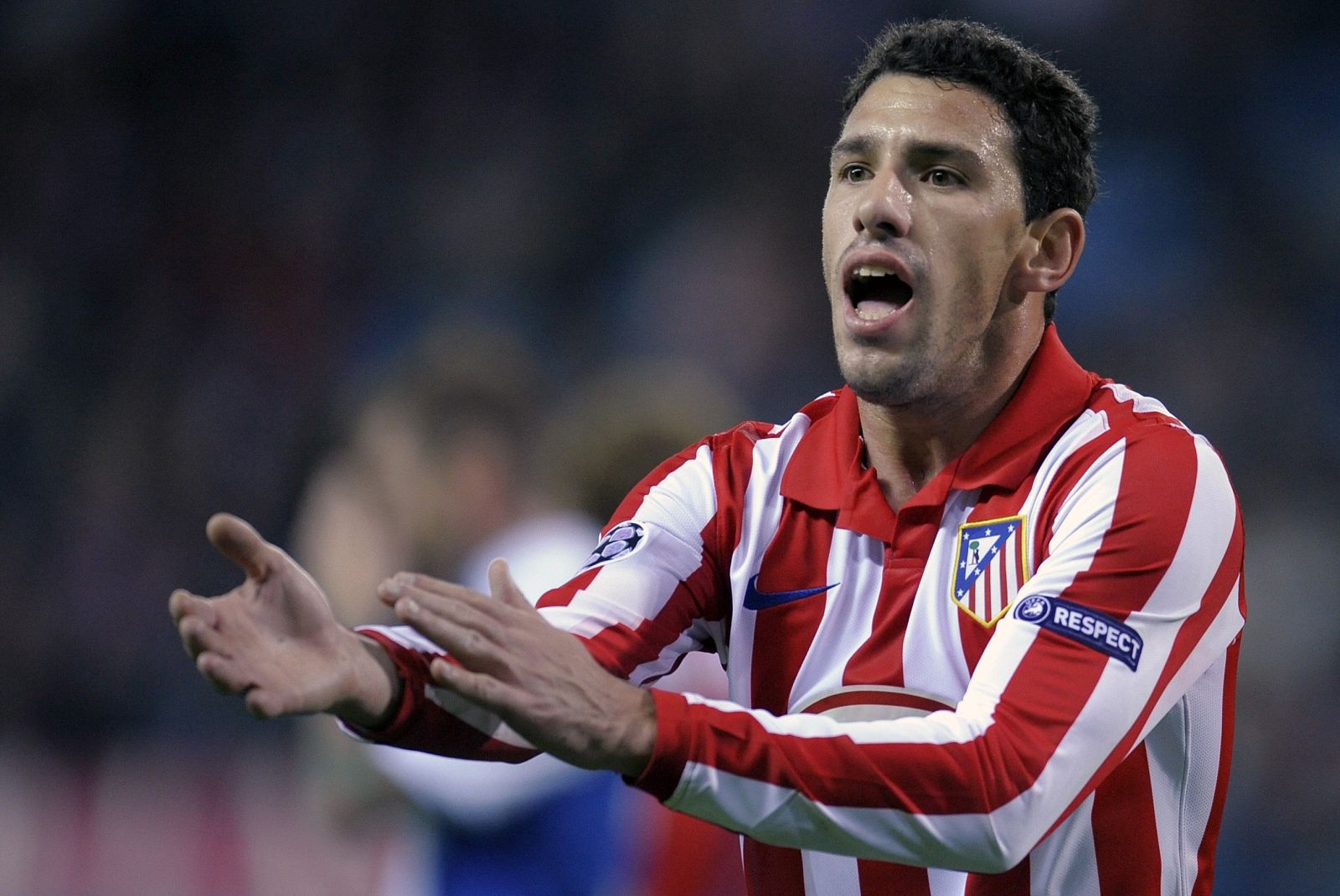 Atletico Madrid's Rodriguez argues with referee during their Champions League soccer match against Porto in Madrid