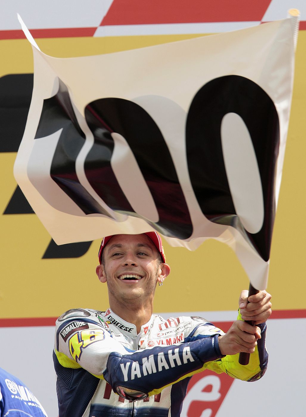 Yamaha MotoGP rider Rossi of Italy celebrates on the podium after winning the Dutch Motorcycling Grand Prix in Assen