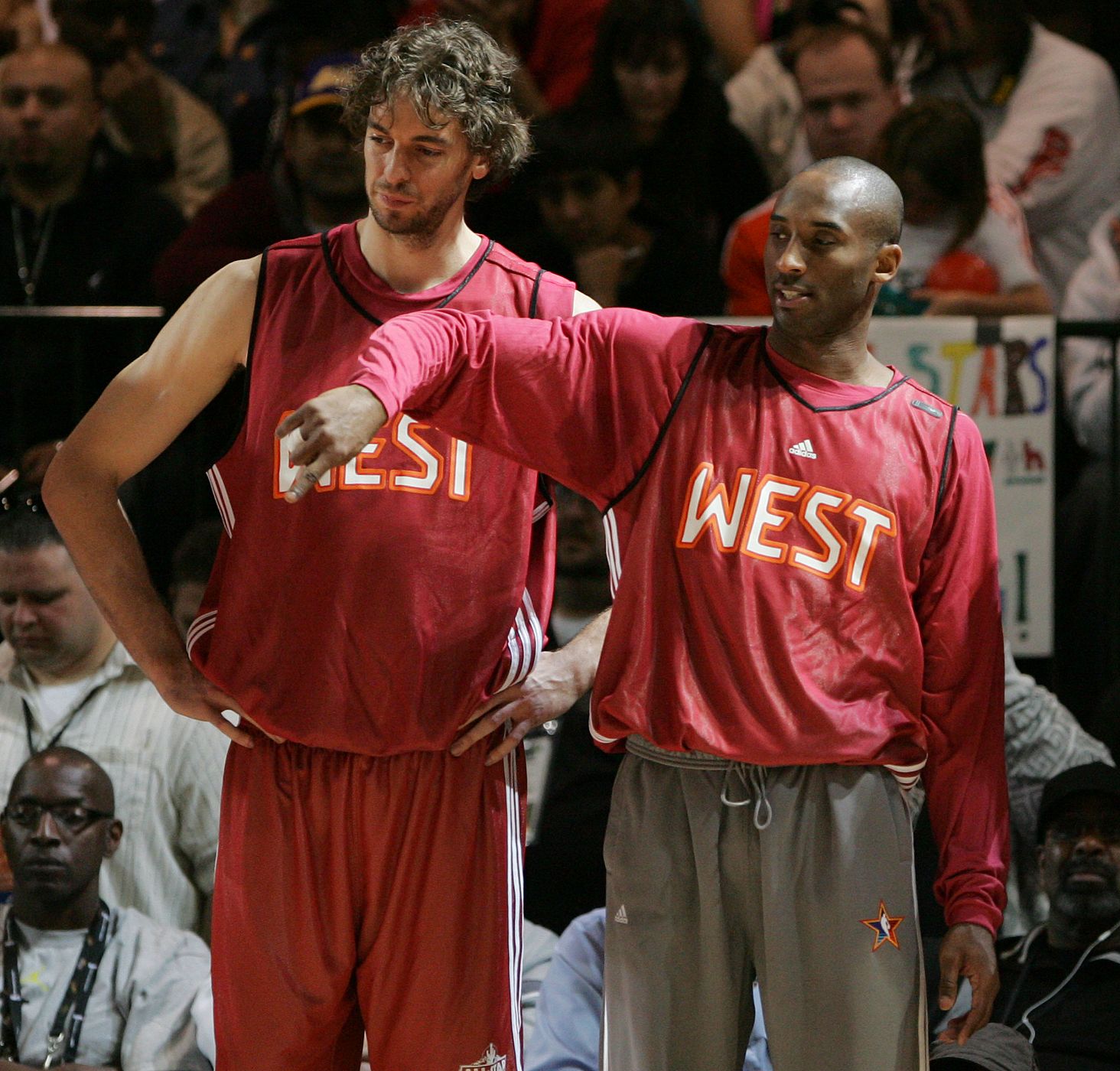 Lakers Pau Gasol of Spain and Kobe Bryant watch as their teammates run drills during practice at the NBA All-Star basketball weekend in Phoenix