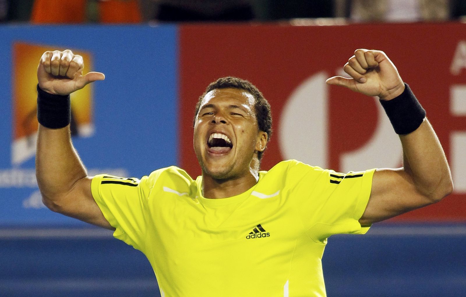France's Jo-Wilfried Tsonga celebrates his quarter-final win over Novak Djokovic of Serbia at the Australian Open tennis tournament in Melbourne