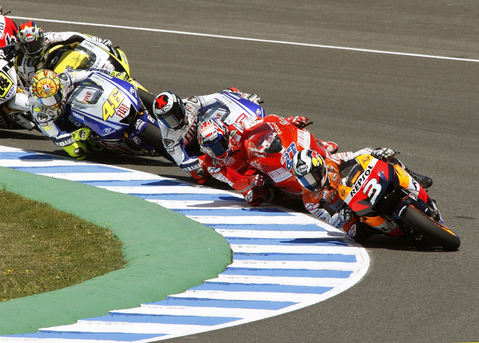 Honda MotoGP rider Dani Pedrosa of Spain leads the pack at the start of the race during the Spanish Motorcycling GP
