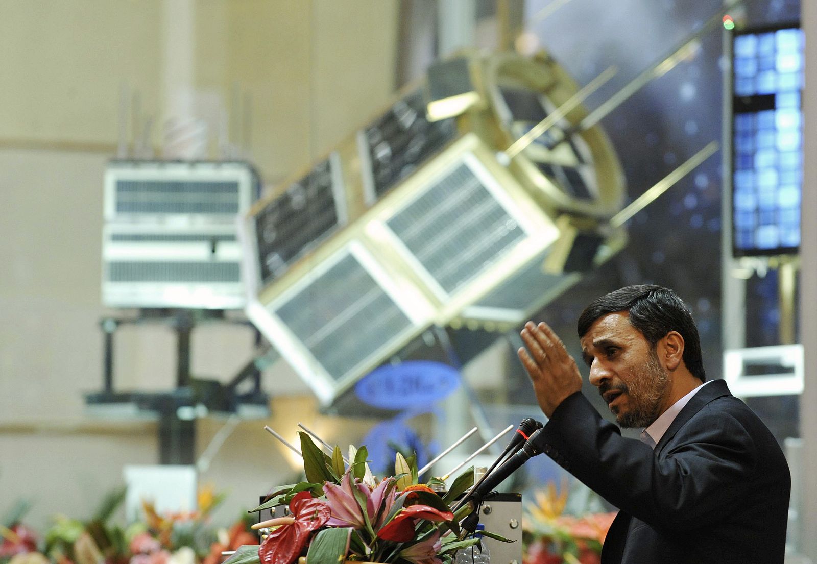 Iranian President Mahmoud Ahmadinejad speaks during a ceremony to introduce the domestically produced Simorq propulsion system for rockets to carry satellites into space during a ceremony in Tehran