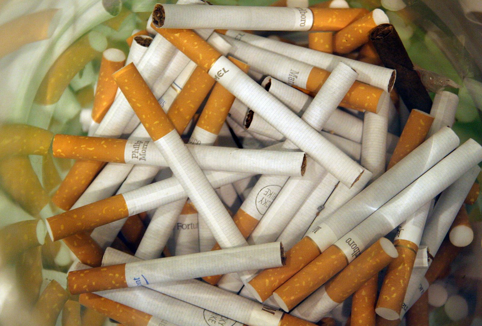 A cylinder is stuffed full of cigarettes in a Madrid restaurant as part of a charity fund for tobacc..