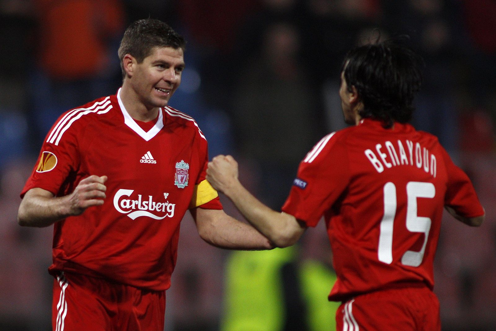 Liverpool's Benyoun congratulates his teammate Gerrard after scoring against Unirea Urziceni during their Europa League soccer match in Bucharest