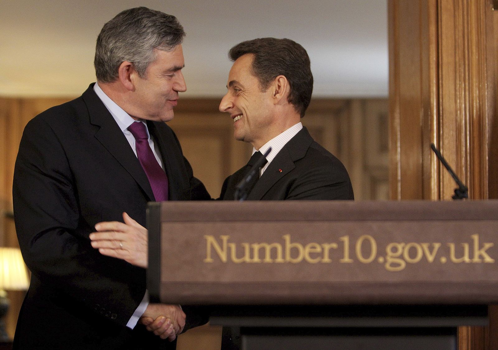 Britain's Prime Minister Gordon Brown stands with France's President Nicolas Sarkozy inside 10 Downing Street in central London