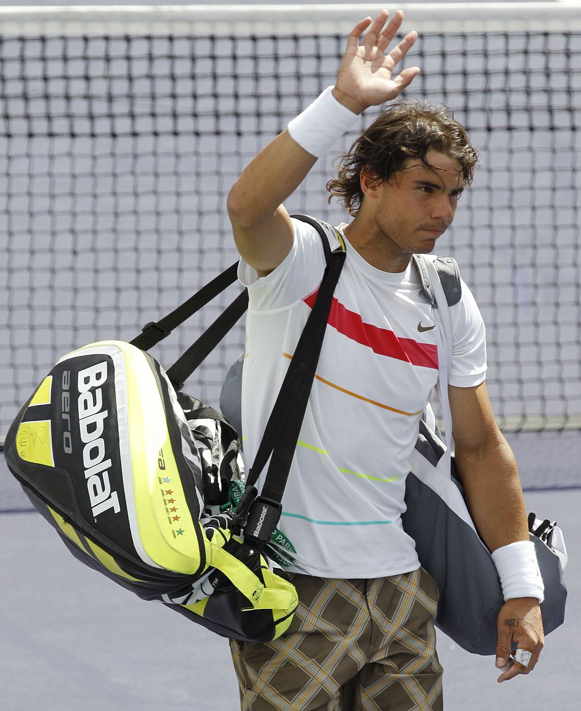 Nadal of Spain waves to the crowd after losing to Ljubicic of Croatia during Indian Wells ATP tennis tournament in California