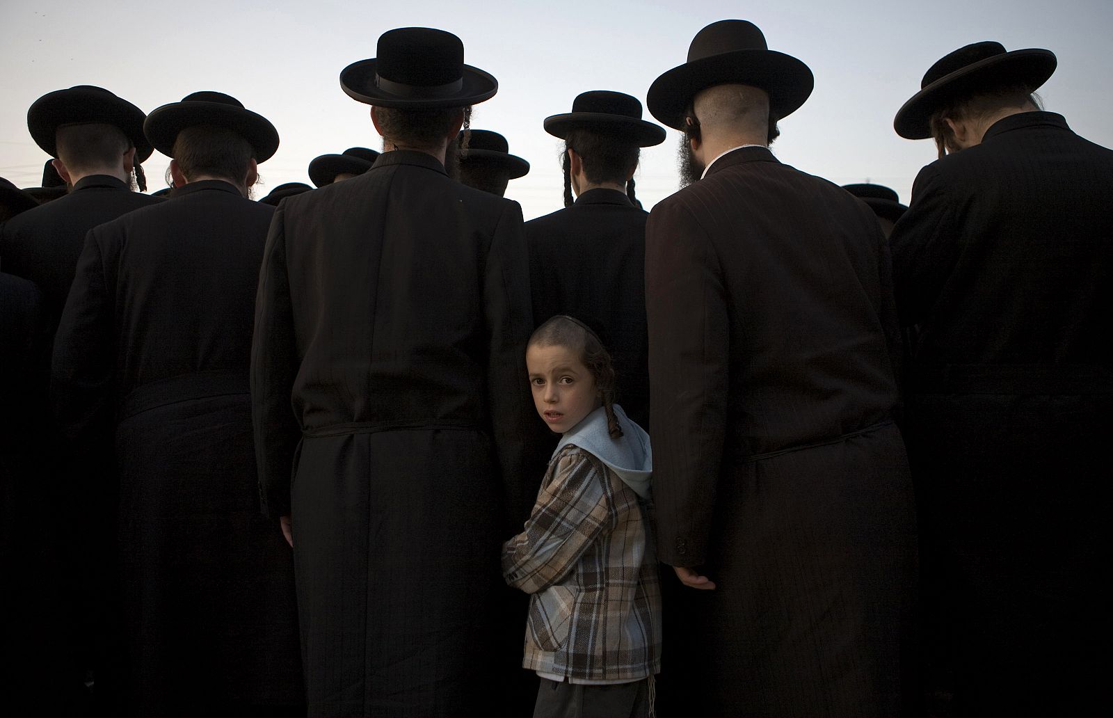Ultra-Orthodox Jews collect water from a spring near the West Bank Jewish settlement of Beit Horon
