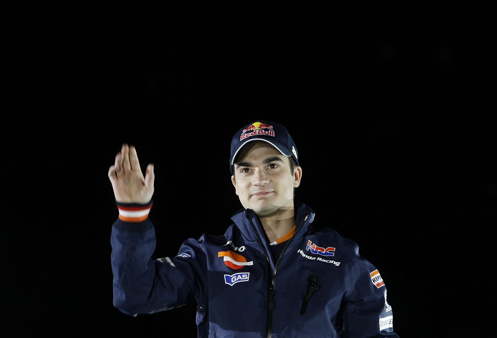 MotoGP rider Pedrosa of Spain waves during the presentation of the new Repsol Honda RC212V 2010 motorcycle in Madrid
