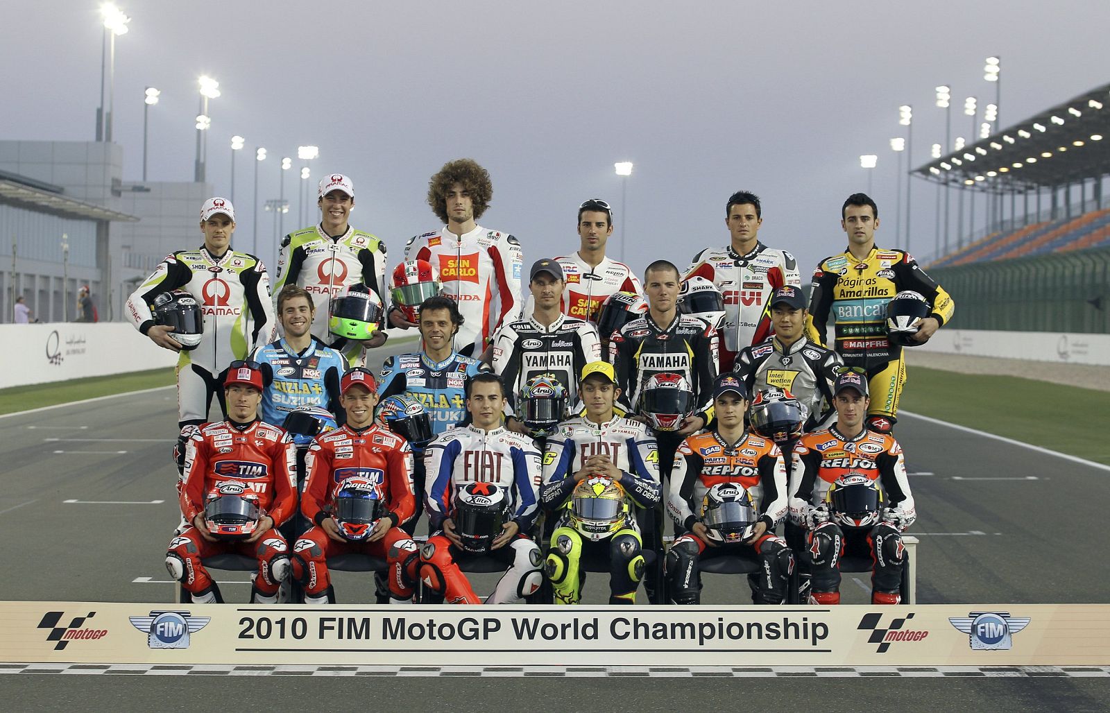 MotoGP riders pose for a group photo before the start of the training session at the MotoGP World Championship