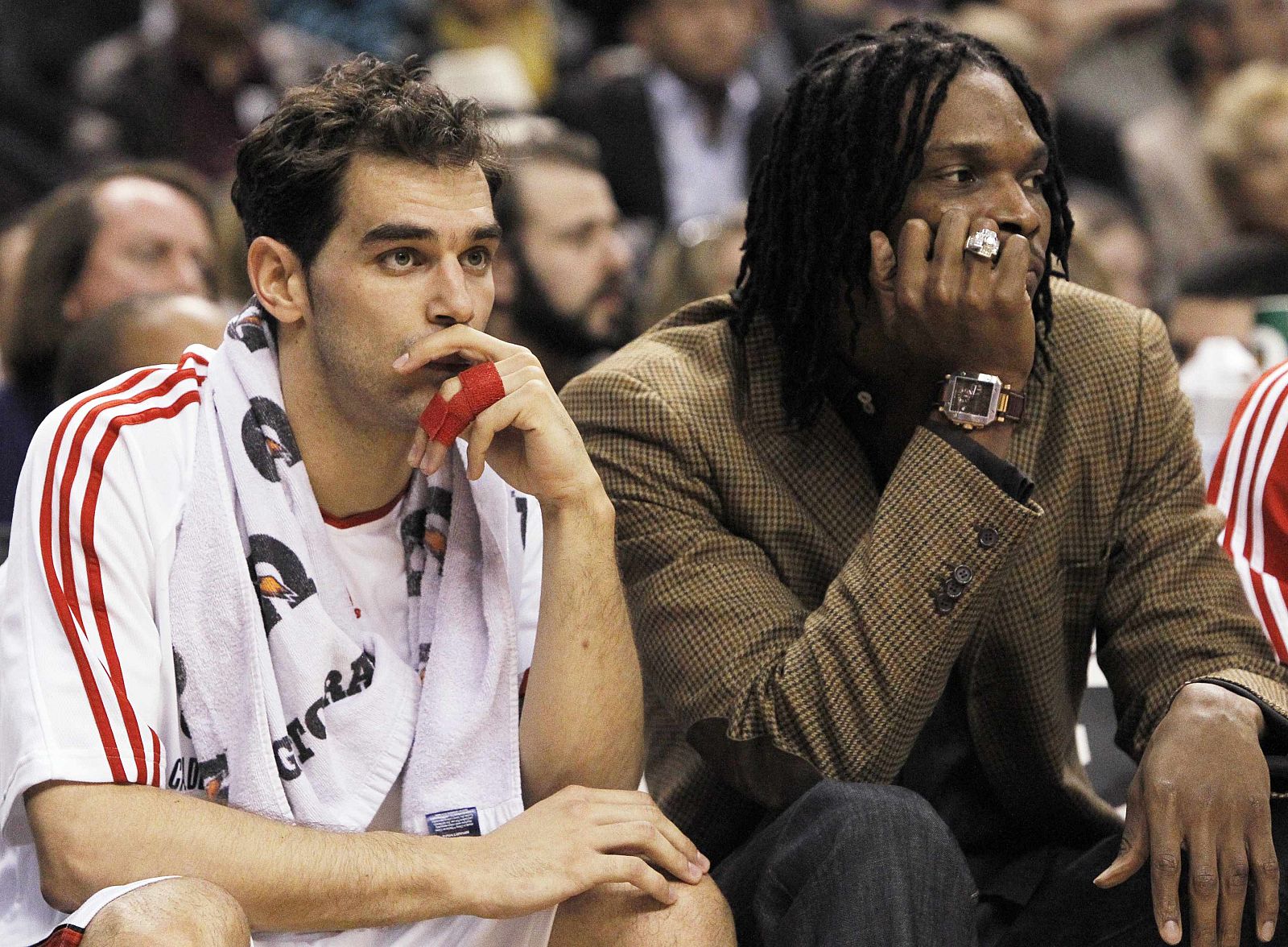 Raptors Bosh and Calderon sit on the bench as their team plays the Knicks during their NBA basketball game in Toronto