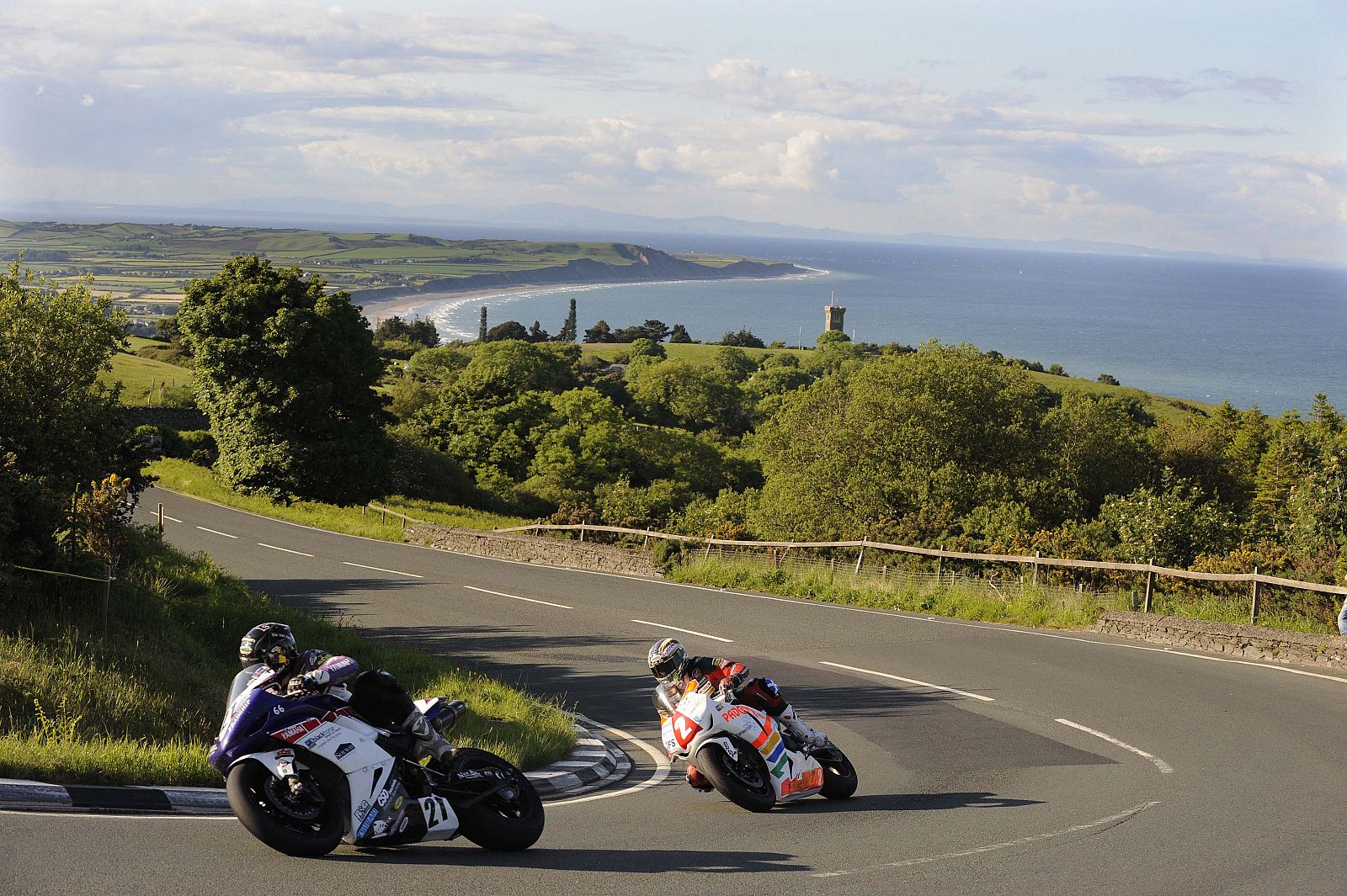 Palmer and McGuiness compete during practice for the TT Superbike race, Isle of Man