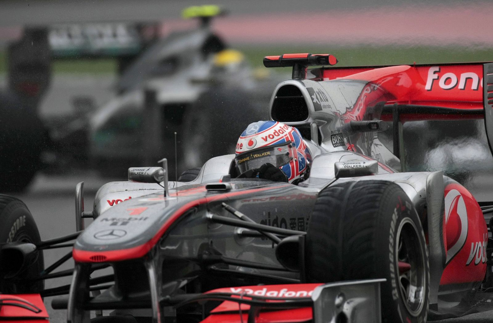 McLaren Formula One driver Jenson Button of Britain drives his car during the Chinese F1 Grand Prix at Shanghai International Circuit