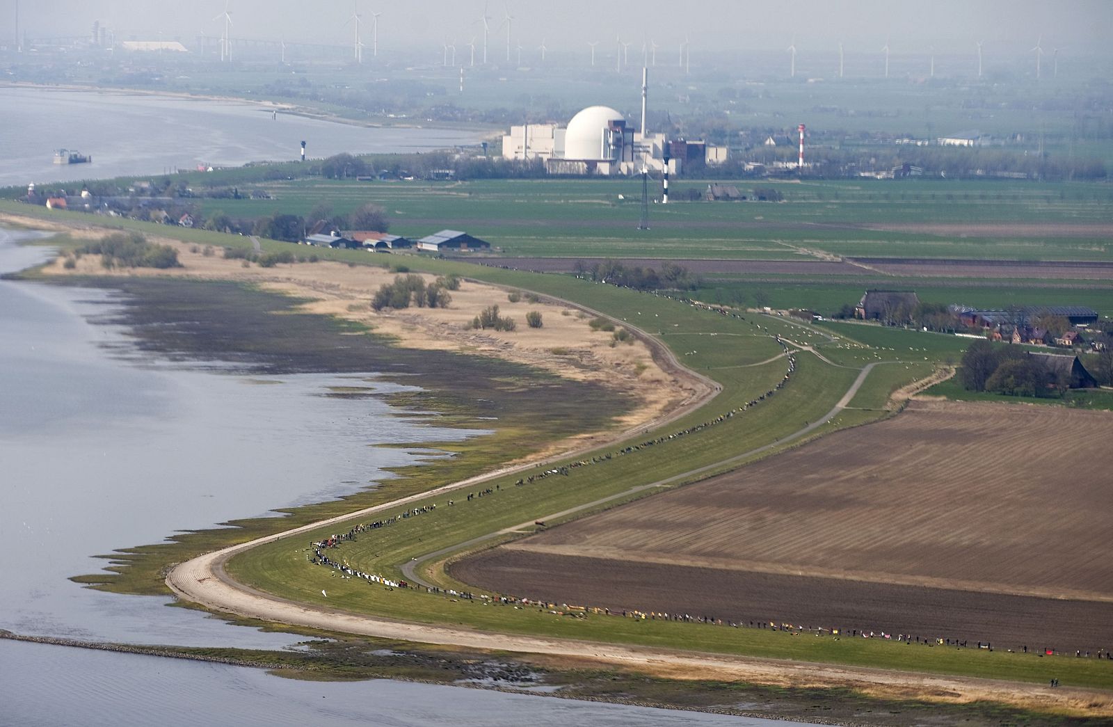 Aerial view shows anti-nuclear protesters as they form a human chain near the nuclear power plant Brokdorf