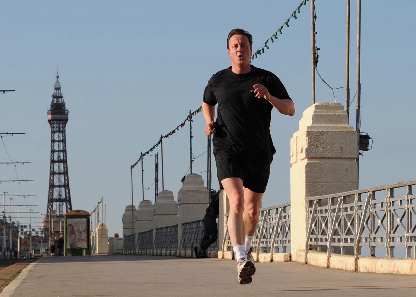Britain's opposition Conservative Party leader, David Cameron, jogs along the seafront in Blackpool, northern England