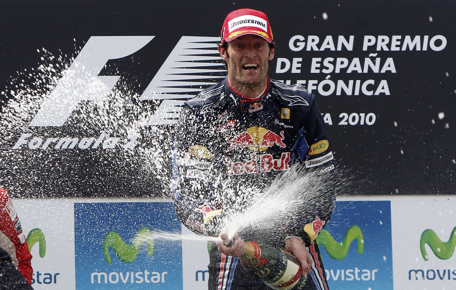 Webber sprays champagne as he celebrates winning the Spanish F1 Grand Prix at Montmelo in Barcelona