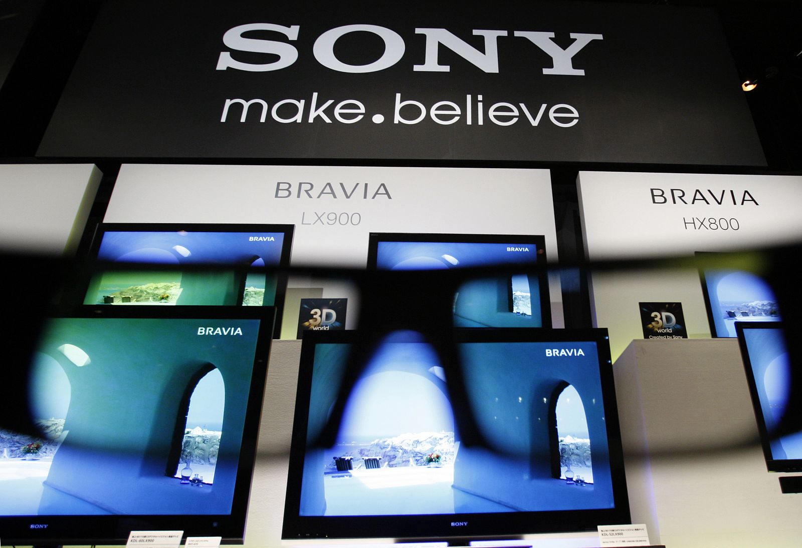A pair of 3D glasses is displayed in front of Sony Corp's new 3D Bravia televisions in Tokyo