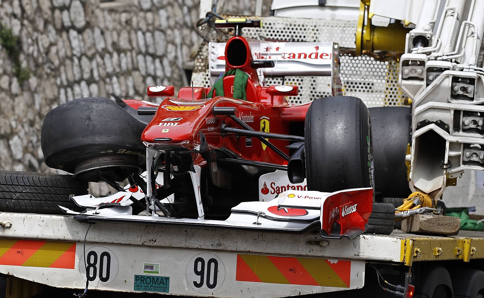 The car of Ferrari Formula One driver Fernando Alonso of Spain is removed on a truck after a crash during the third practice session of the Monaco F1 Grand Prix