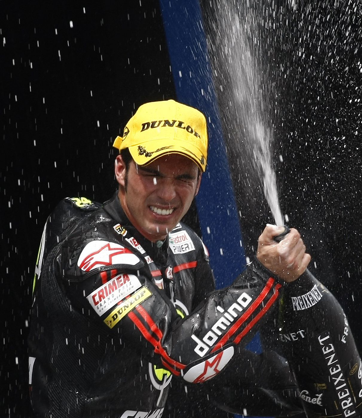 Moriwaki Moto2 rider Elias of Spain celebrates with champagne on podium after winning the race of the Spanish Grand Prix in Jerez