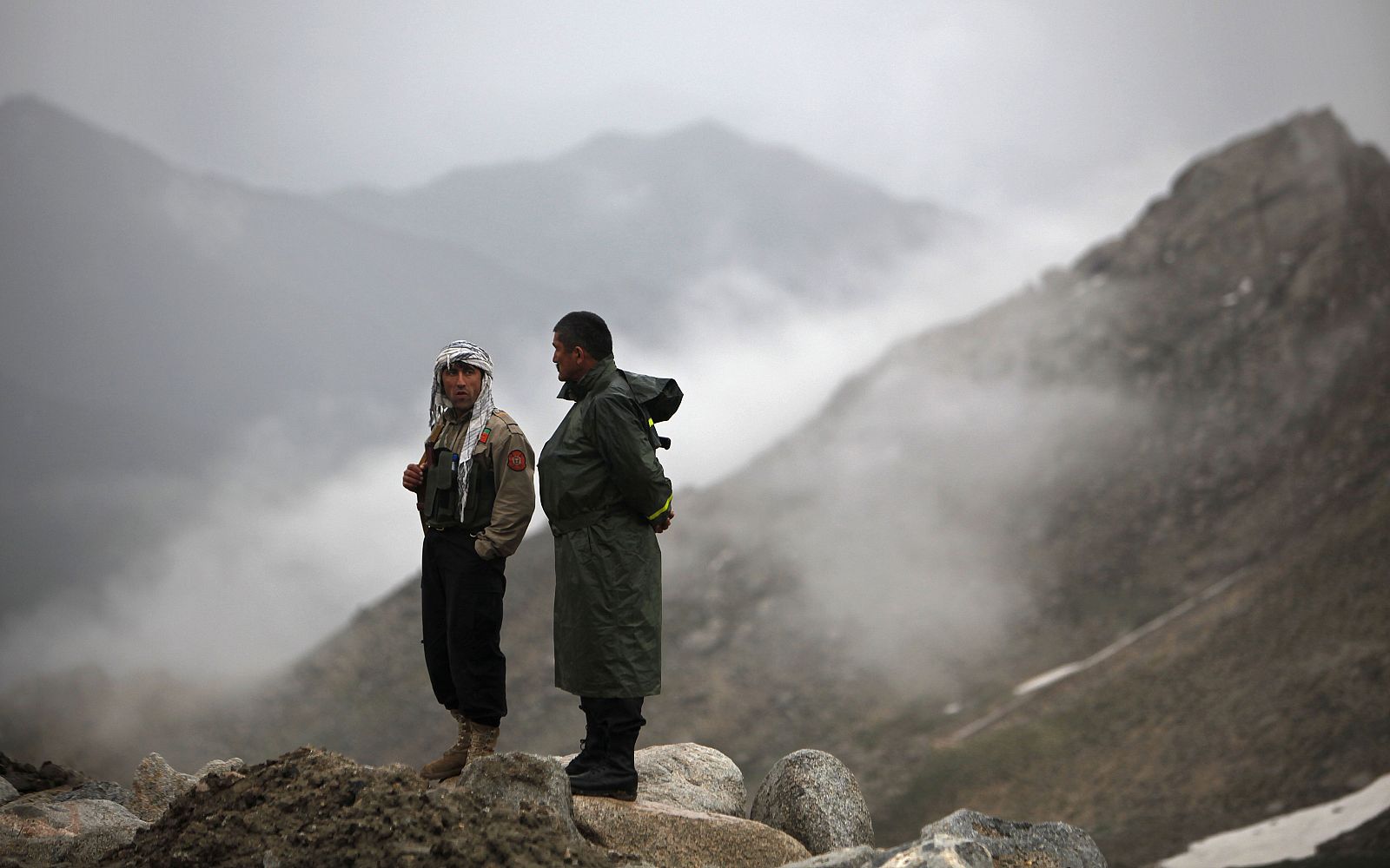 Afghan security personnel are on standby near the mountains where an Afghan Pamir Airways plane is believed to have crashed in the Salang pass
