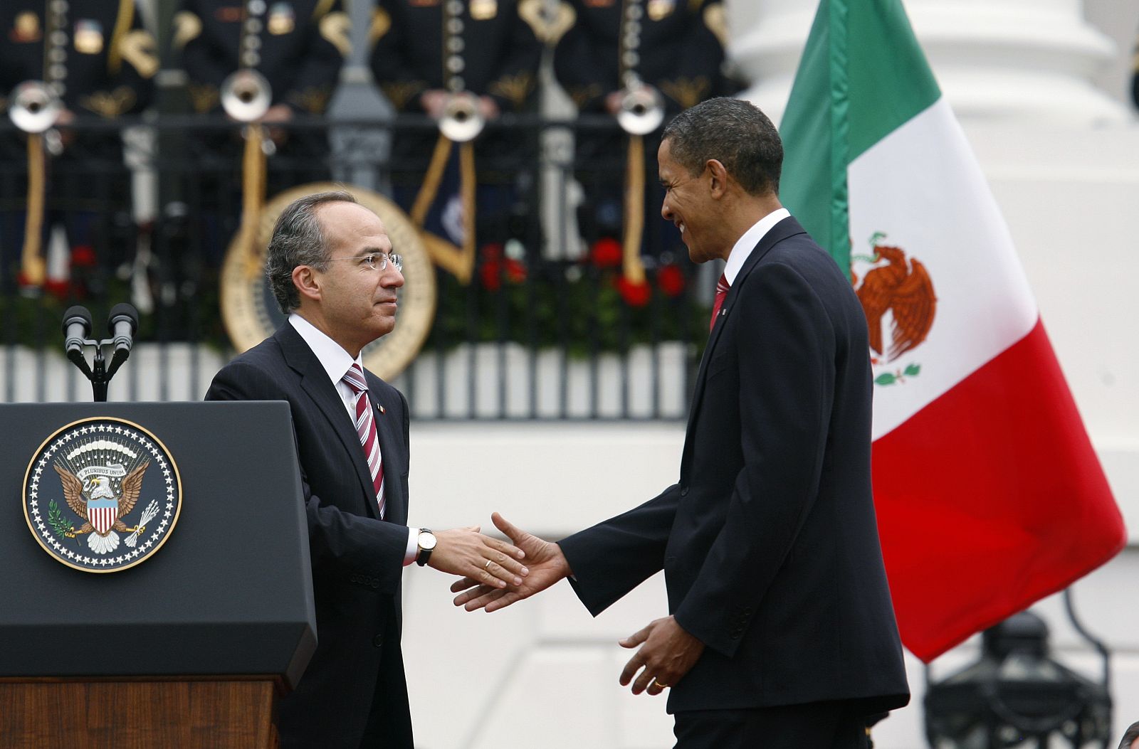 President Obama and Mexican President Calderon shakes hands during the official arrival ceremony on the South Lawn at the White House in Washington