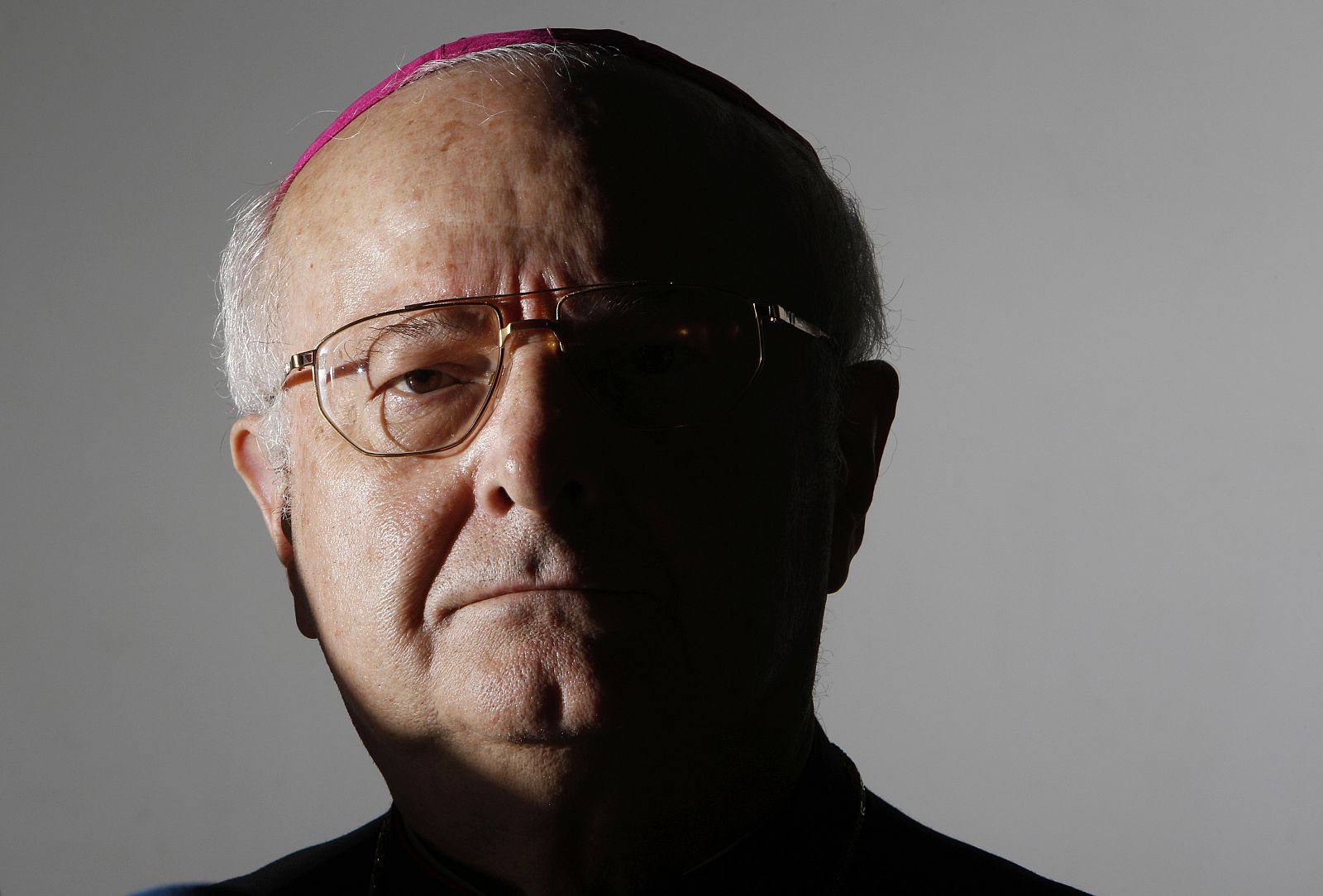 Archbishop Robert Zollitsch, head of the German Bishops' Conference, looks on during a news conference at the Vatican