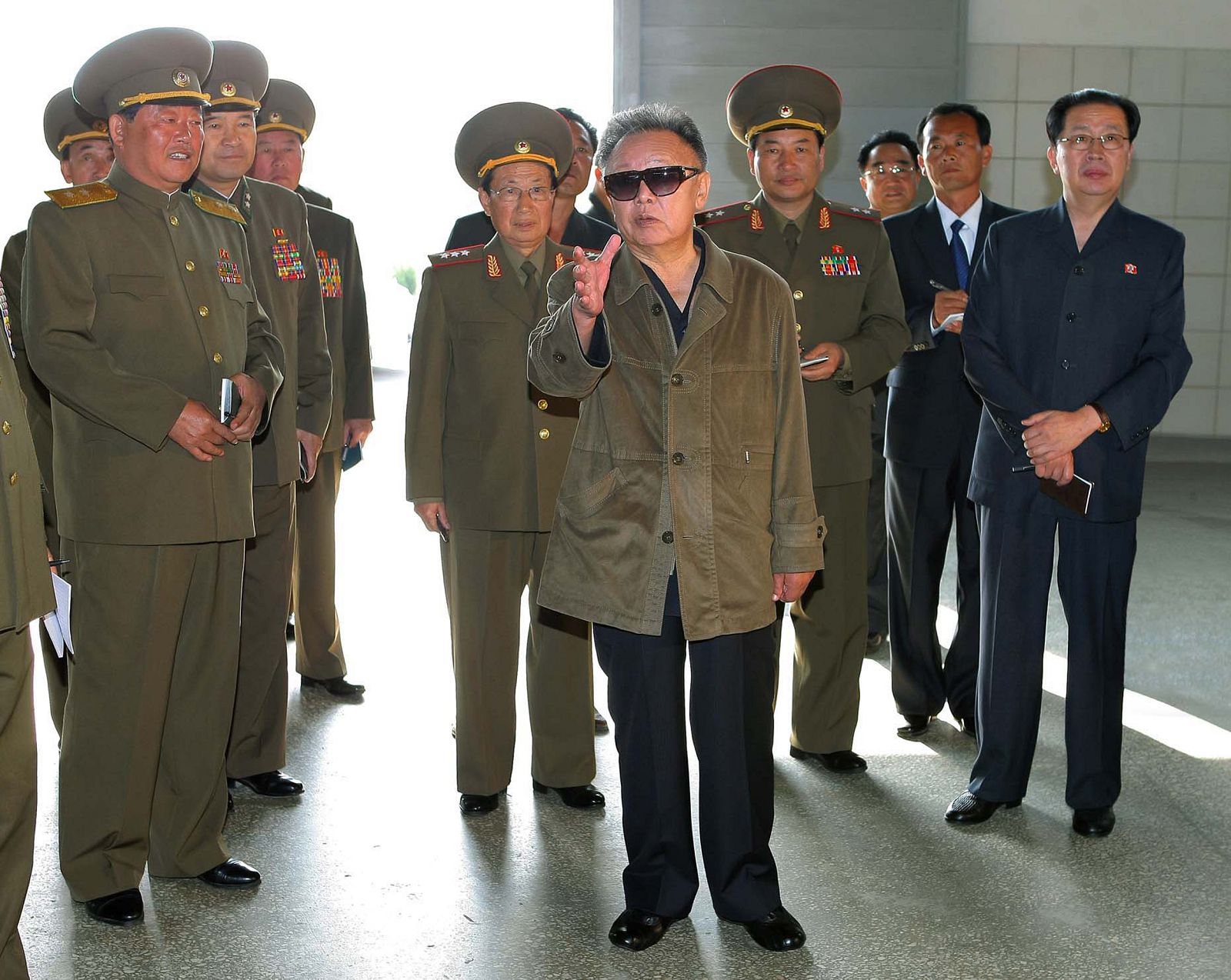 North Korean leader Kim Jong-il visits the Taedonggang Combined Fruit Farm at an undisclosed place in North Korea in this undated picture released by North Korea's official news agency KCNA