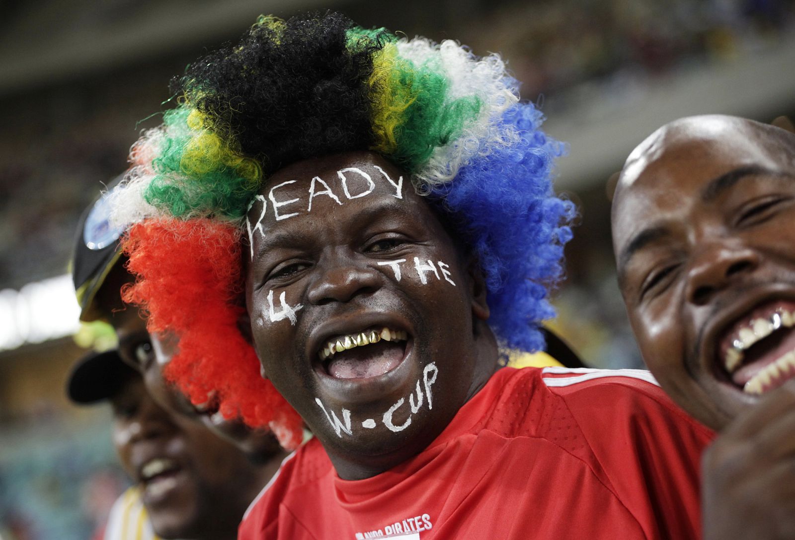 South African fan, with his face painted with the words "ready for the World Cup" smiles ahead of the international friendly soccer match between South Africa and Namibia in Durban