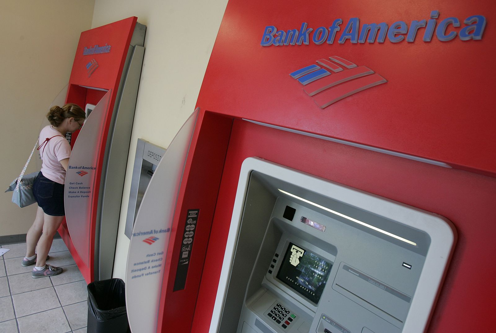 Julie Esterline uses an automated teller machines at a Bank of America branch in Chicago's Loop.