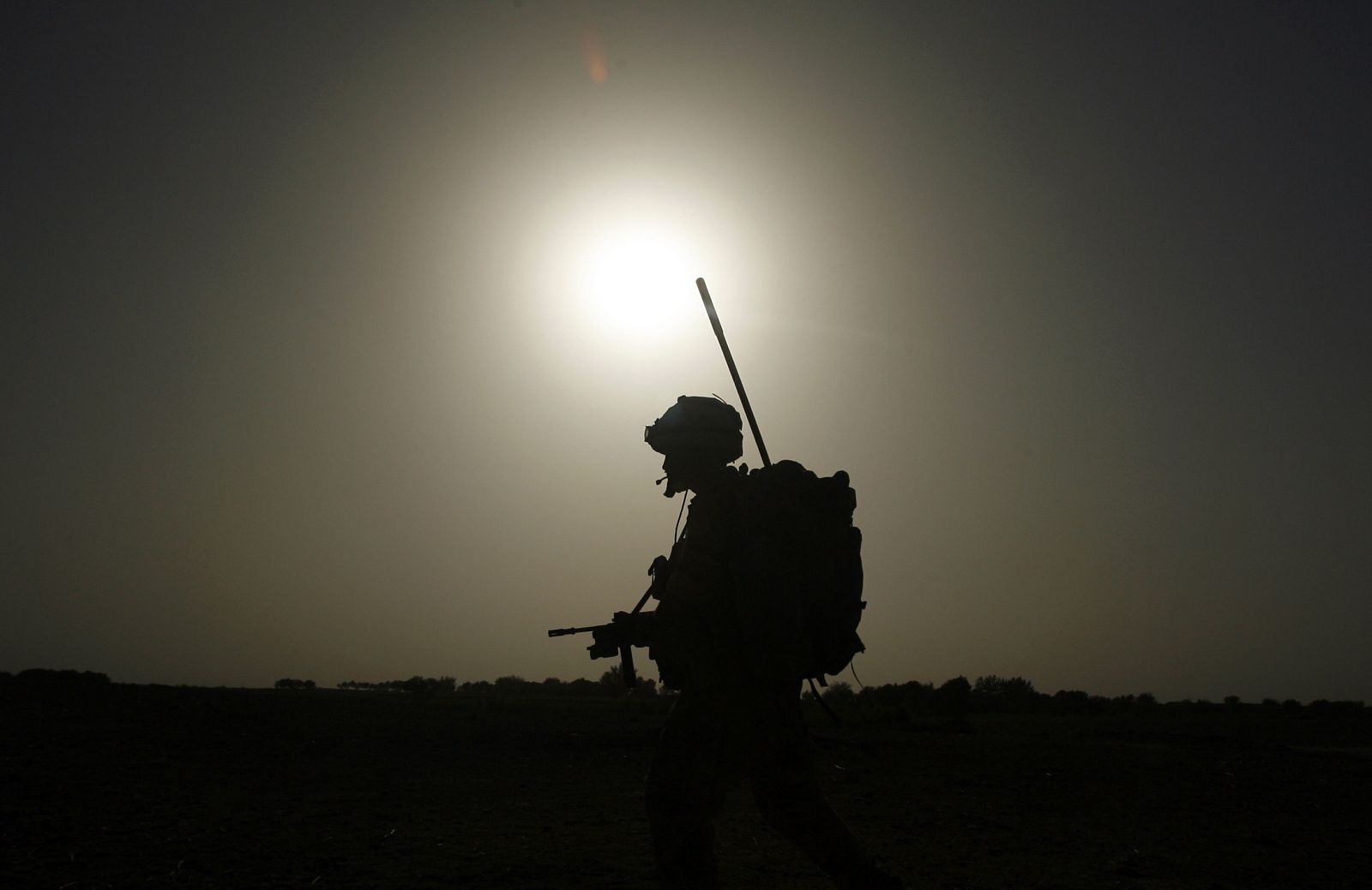 A British soldier from A Company, 2 Mercian patrols in Babaji village in Helmand province