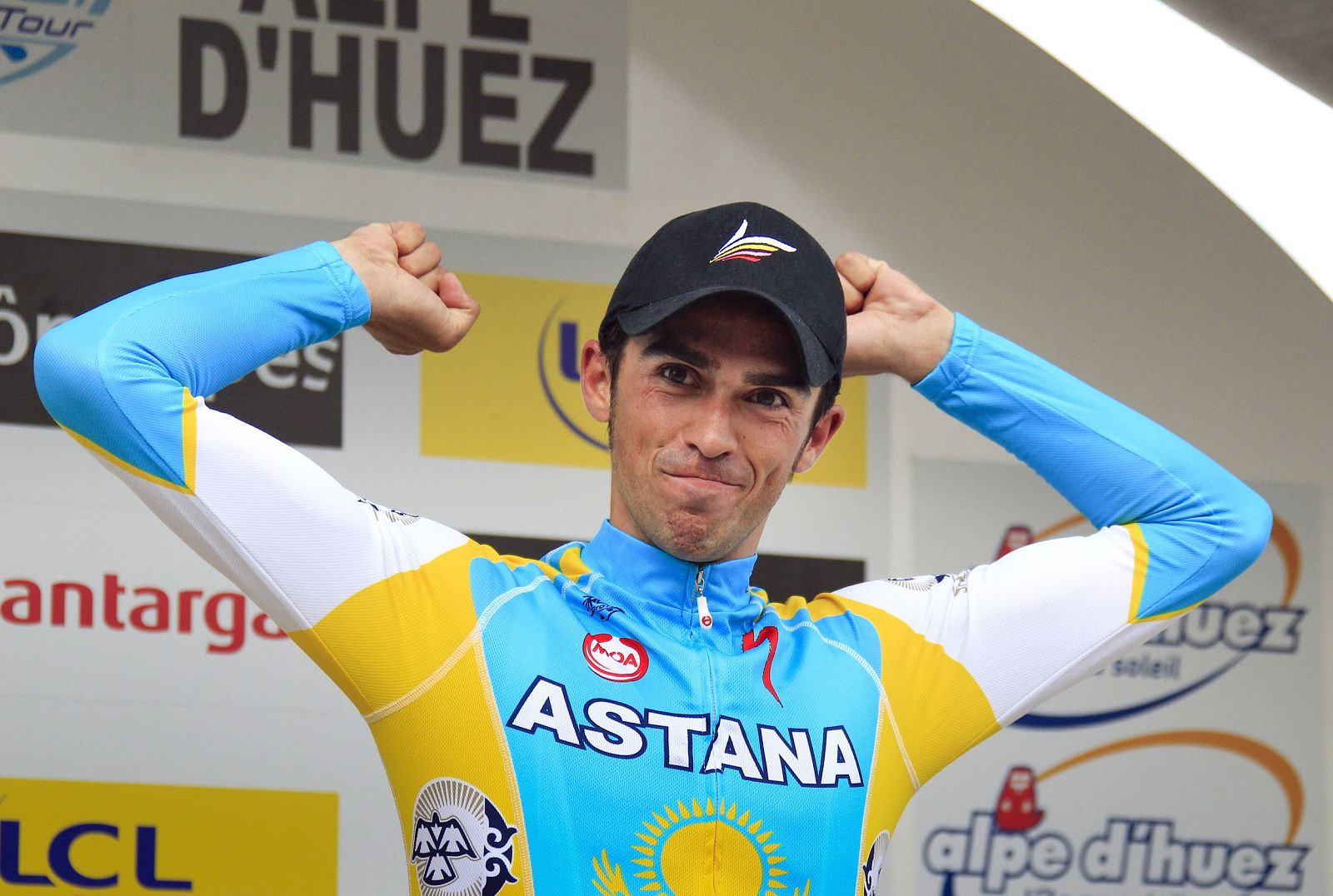 Astana's Alberto Contador of Spain celebrates on the podium after winning the sixth stage of the Dauphine cycling race
