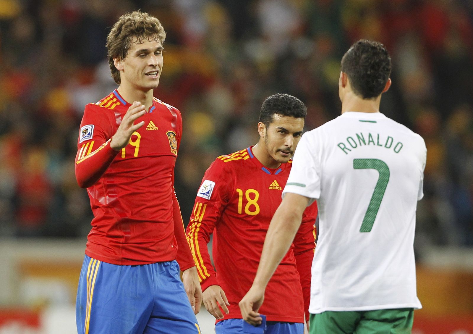 Spain's Llorente shakes hands with Portugal's Ronaldo after the 2010 World Cup second round soccer match between Spain and Portugal at Green Point stadium in Cape Town