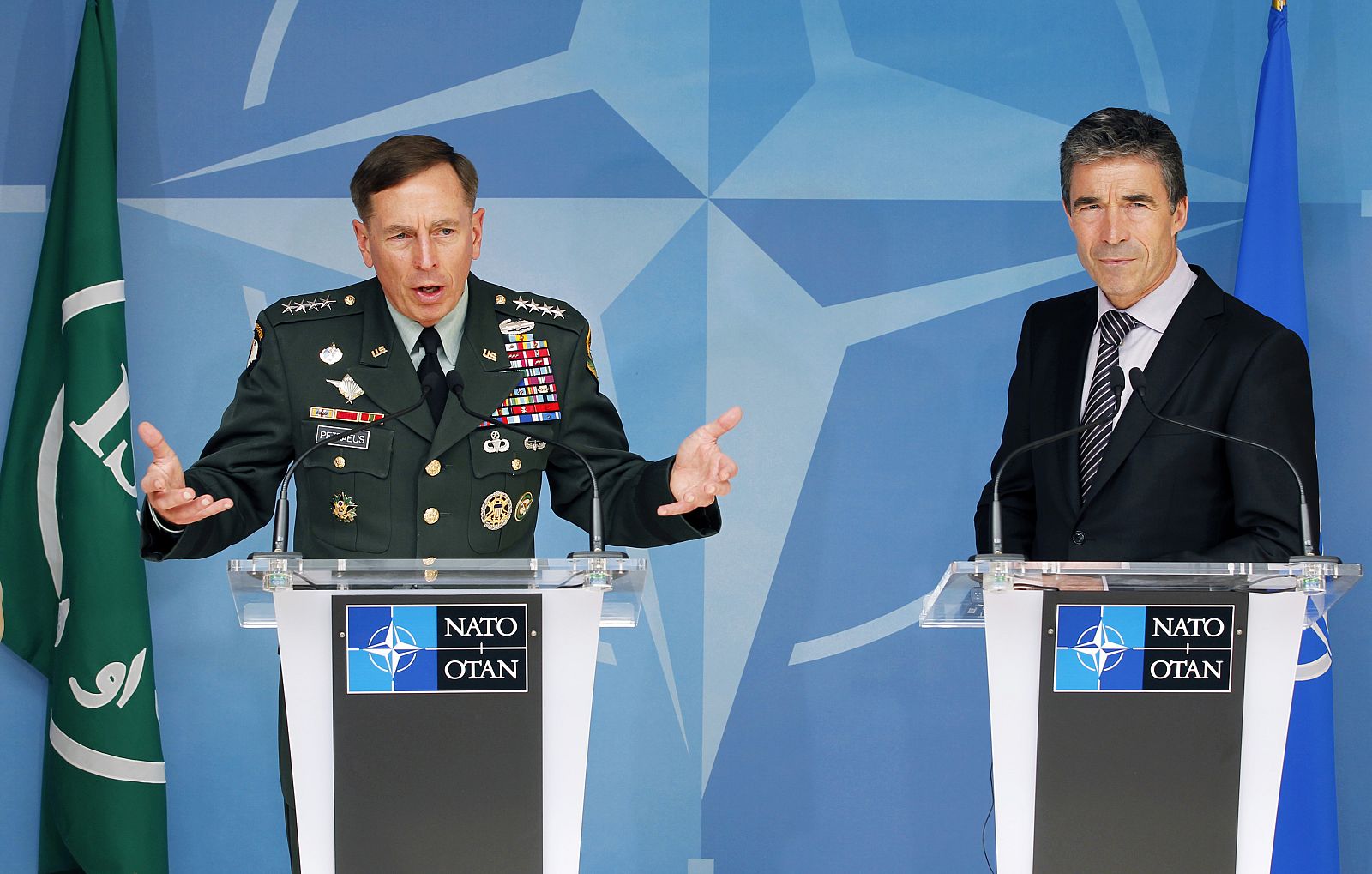 U.S. General Petraeus and NATO Secretary General Rasmussen address a joint news conference in Brussels