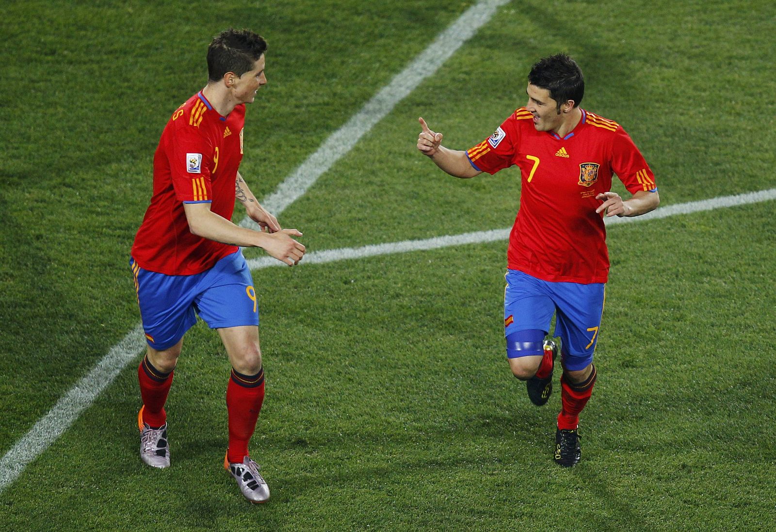 Spain's David Villa celebrates with Torres after scoring against Honduras during a 2010 World Cup Group H match at Ellis Park stadium in Johannesburg