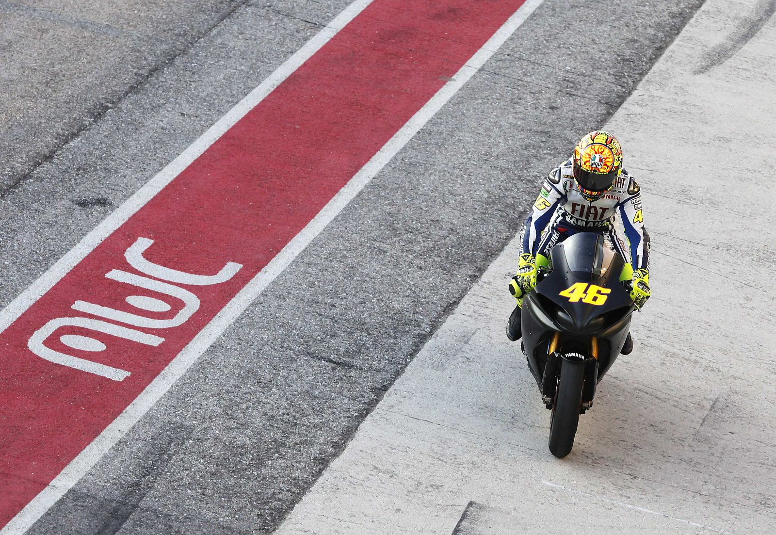 MotoGP world champion Valentino Rossi arrives at the box after a private test at the Misano circuit