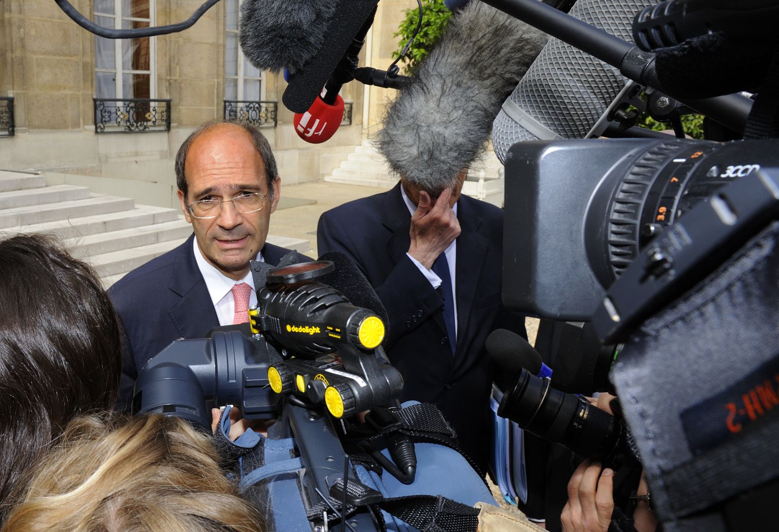 French Labour Minister Eric Woerth leaves the Elysee Palace following the weekly cabinet meeting in Paris