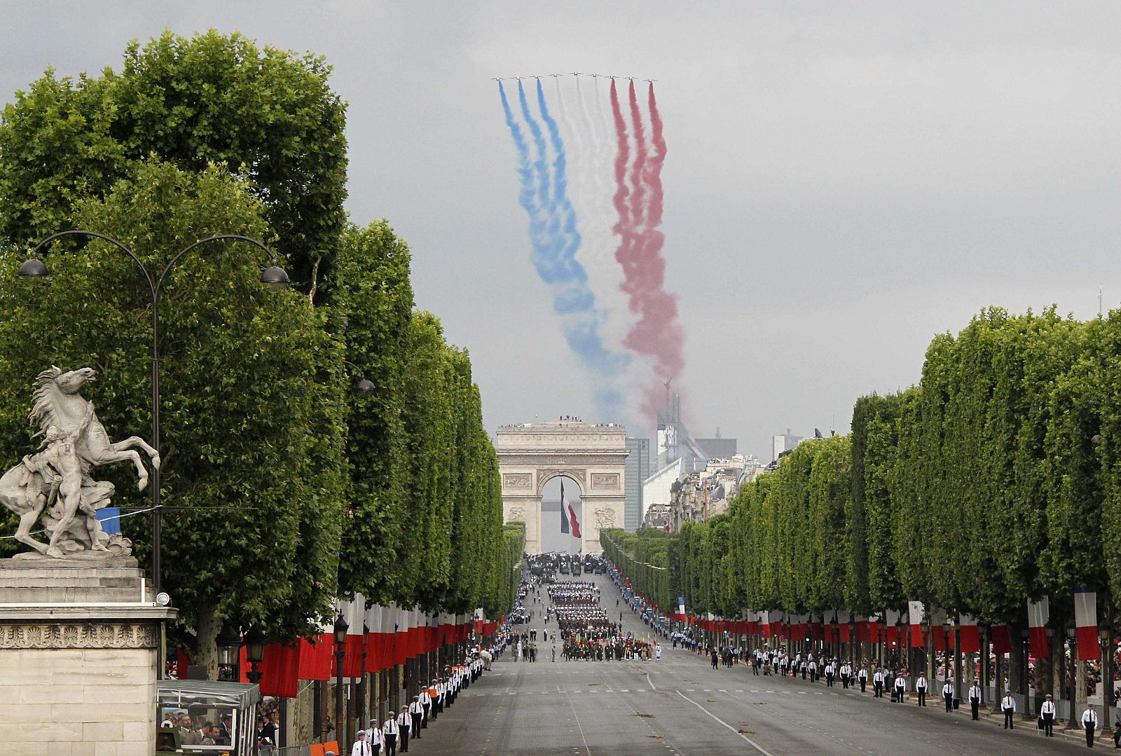 The Patrouille de France flies over the Champs Elysees as part of the traditional Bastille Day parade in Paris