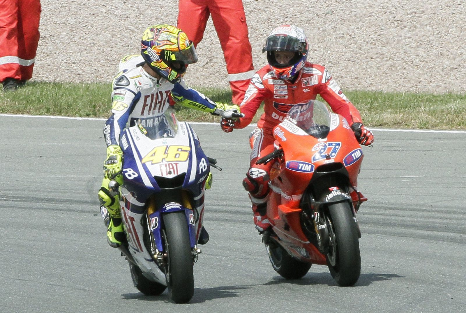 Yamaha MotoGP rider Rossi congratulates Stoner after German Grand Prix at Sachsenring circuit