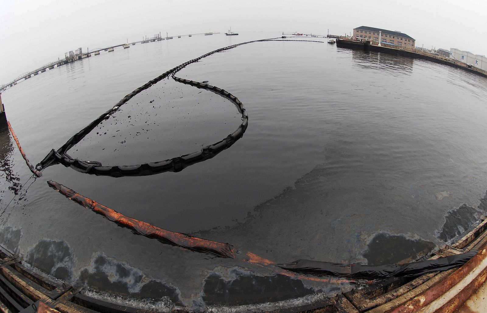 A view shows crude oil in the sea near Dalian