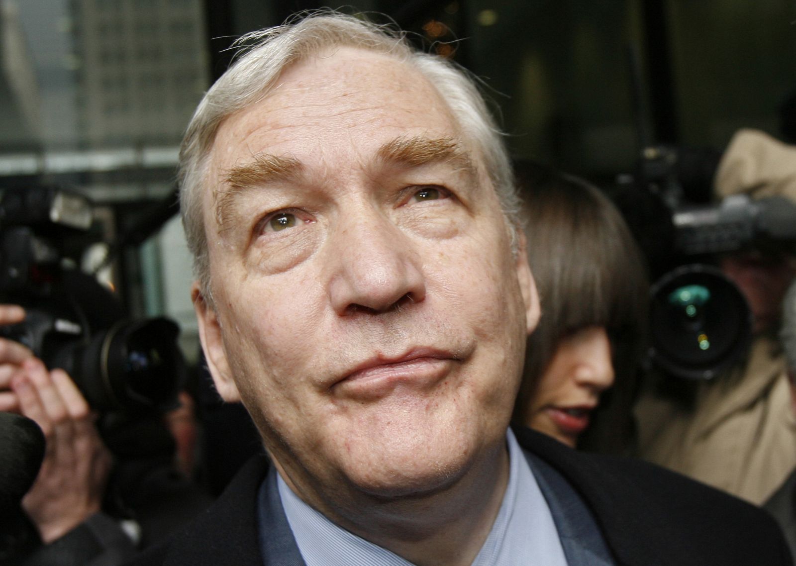 Conrad Black leaves the Dirksen Federal Courthouse after his sentencing hearing in Chicago