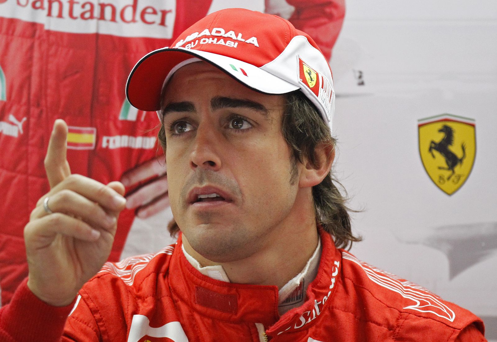 Ferrari Formula One driver Alonso of Spain gestures during the first practice session of the German F1 Grand Prix at Hockenheimring