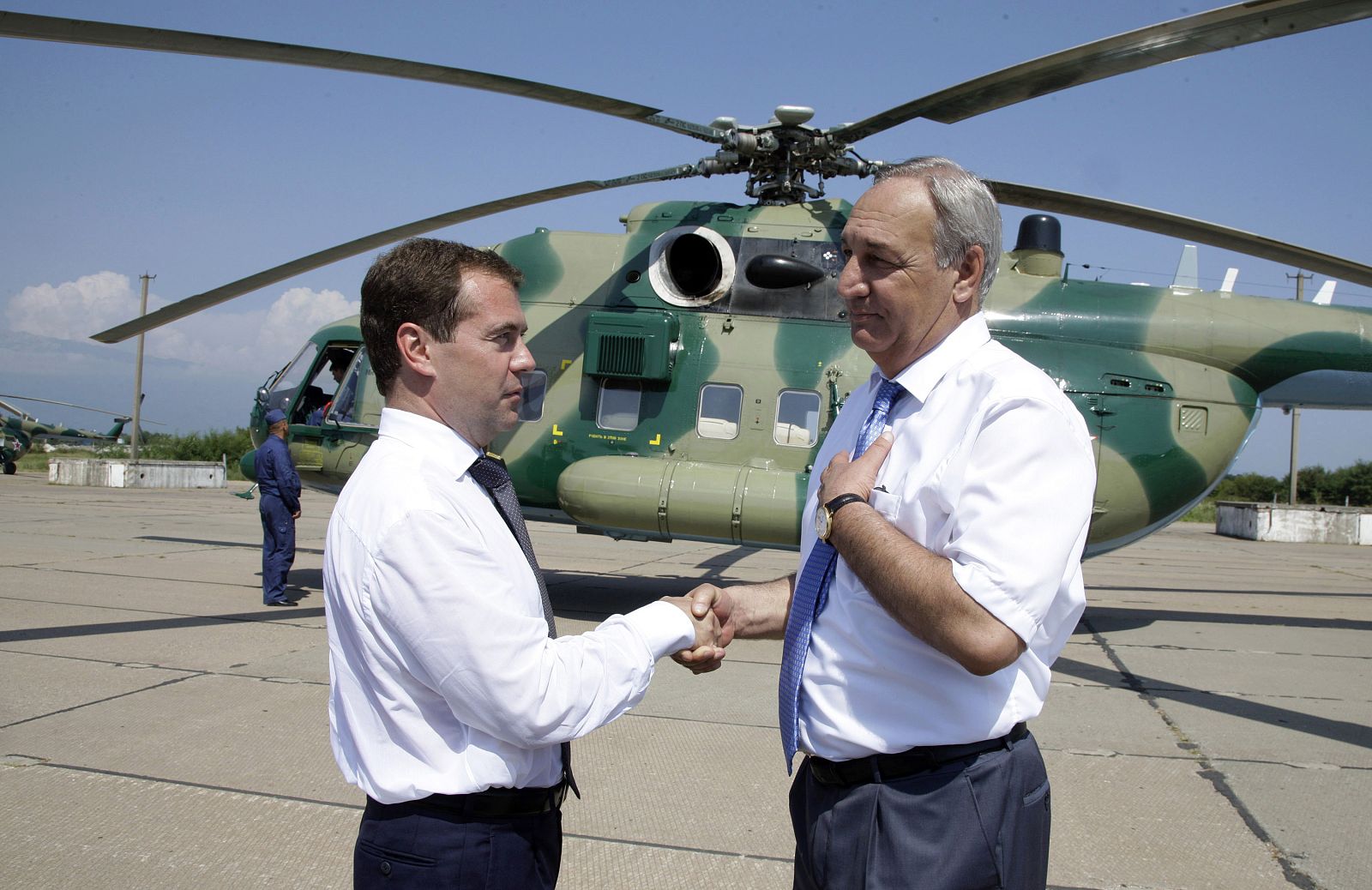 Russia's President Medvedev shakes hands with Abkhazia's President Bagapsh as they visit the Russian military base in Gudauta