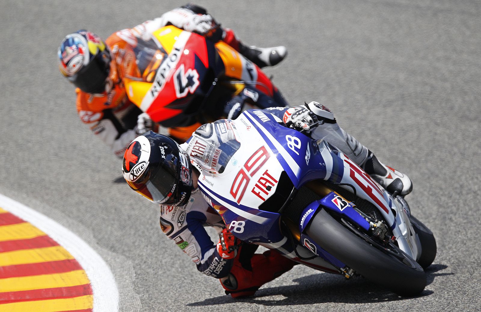 Yamaha Lorenzo of Spain leads Honda Dovizioso of Italy on his way to get the second place in the Italian motorcycling Grand Prix at the Mugello circuit in central Italy
