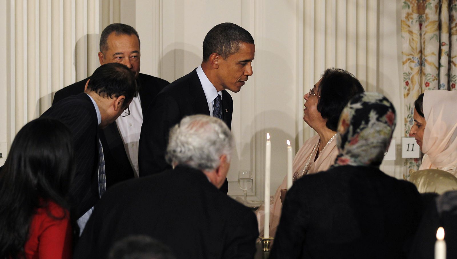 U.S. President Obama greets guests after delivering remarks during the Iftar dinner in Washington