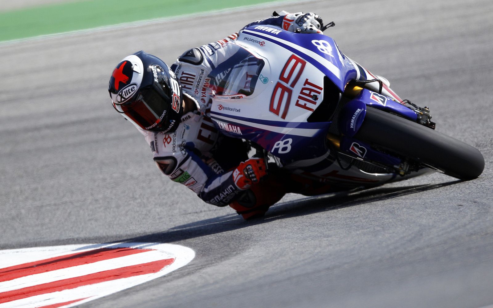 Yamaha MotoGP rider Lorenzo of Spain takes a curve during the first practice session of the San Marino motorcycling Grand Prix at the Misano circuit