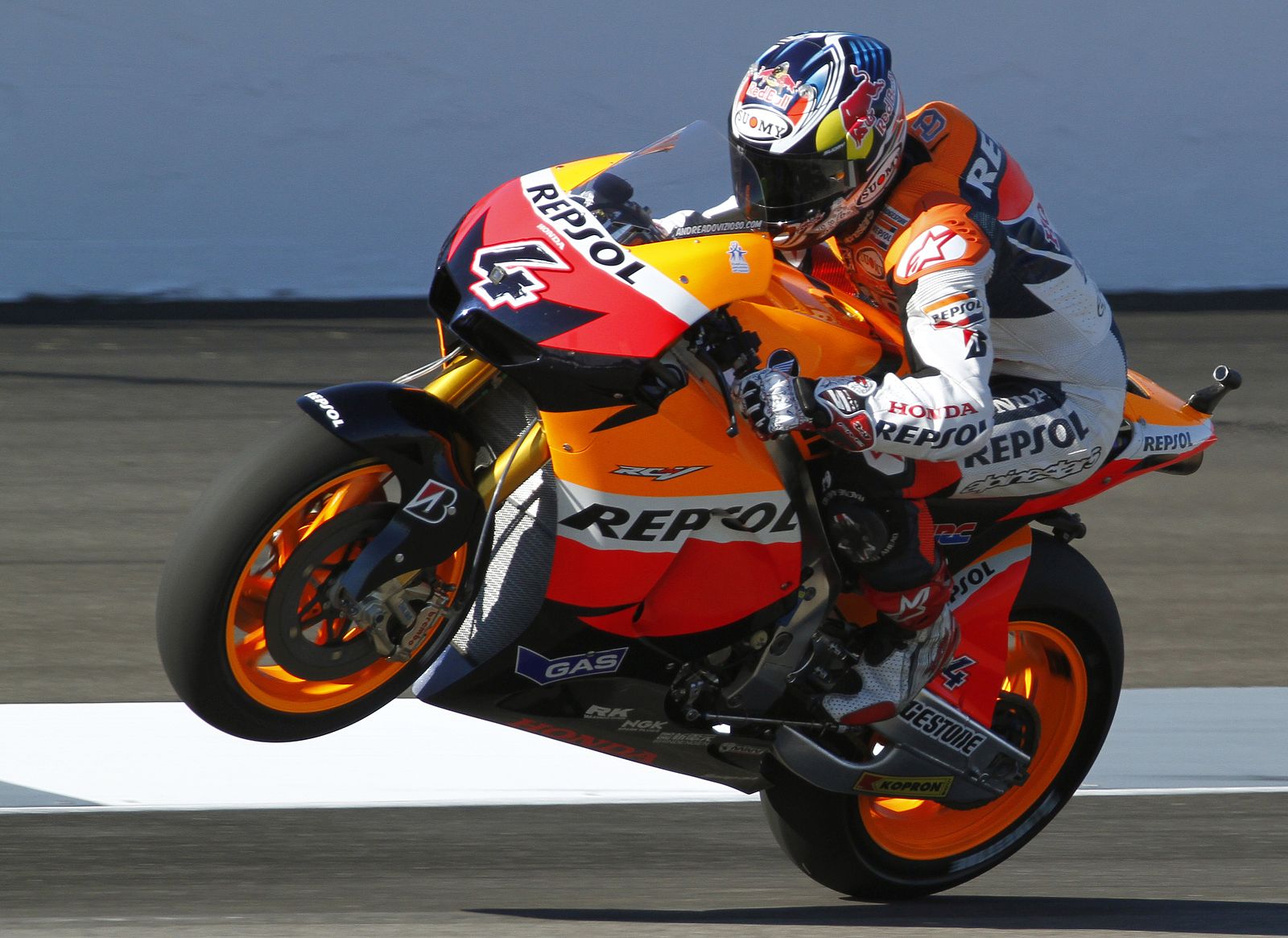 Honda rider Andrea Dovizioso performs a wheelie at the Indianapolis Motor Speedway