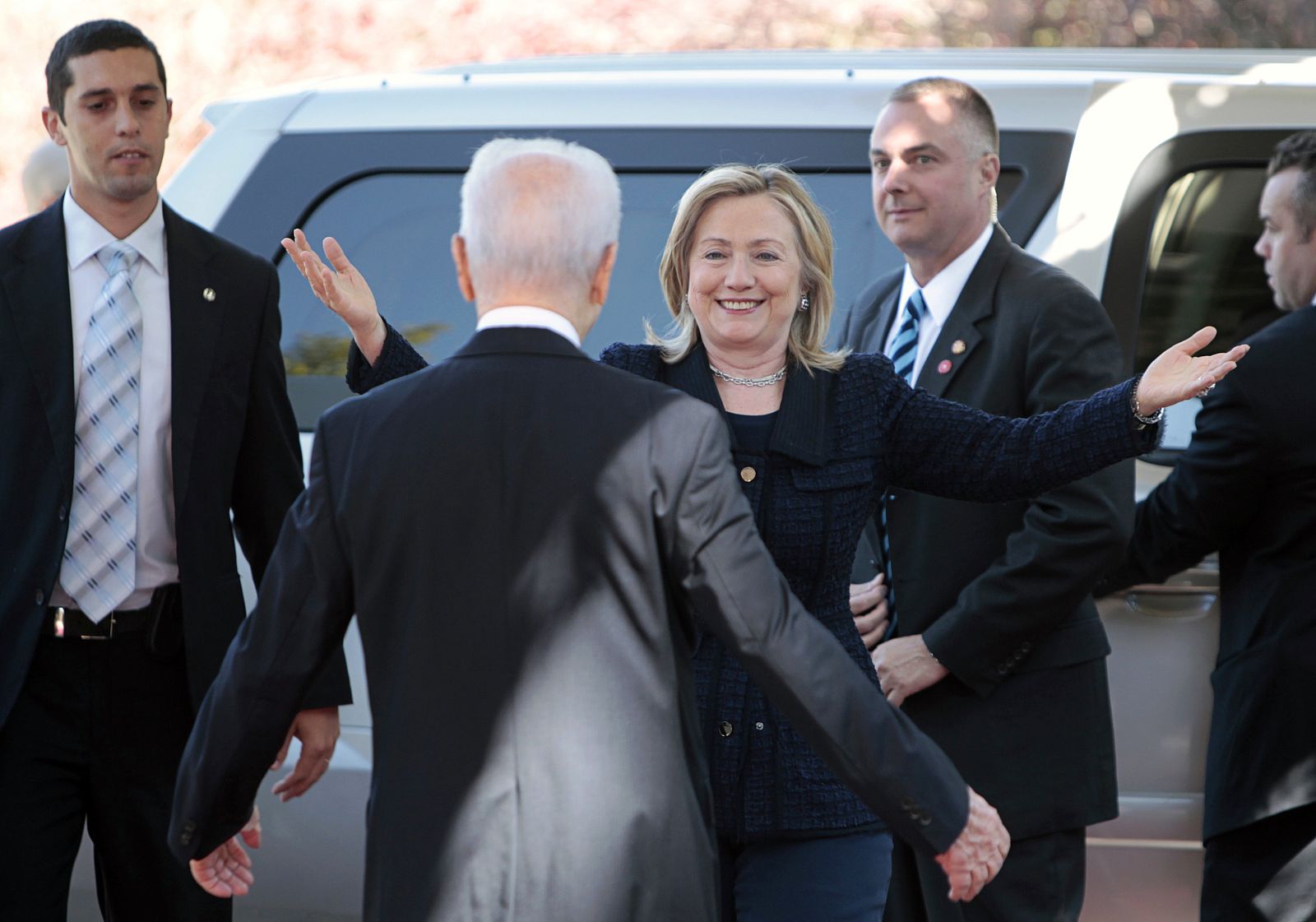 U.S. Secretary of State Clinton greets Israel's President Peres upon her arrival for their meeting in Jerusalem