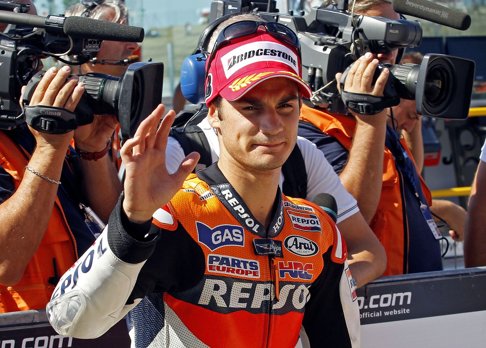 Honda MotoGP Dani Pedrosa of Spain waves after the qualifying session of the San Marino motorcycling Grand Prix at the Misano circuit